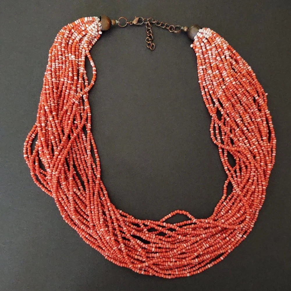 Orange and white multi strand seed bead necklace